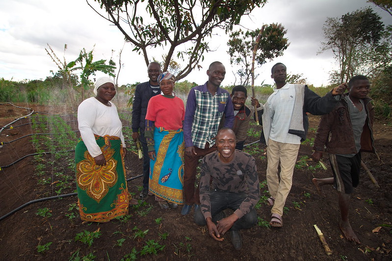 Farmers and team members of CIP and IWMI celebrate the development of irrigation facilities that enables OFSP vine producers to increase productivity and quality of produce (PHOTO: IWMI/Sander Zwart)